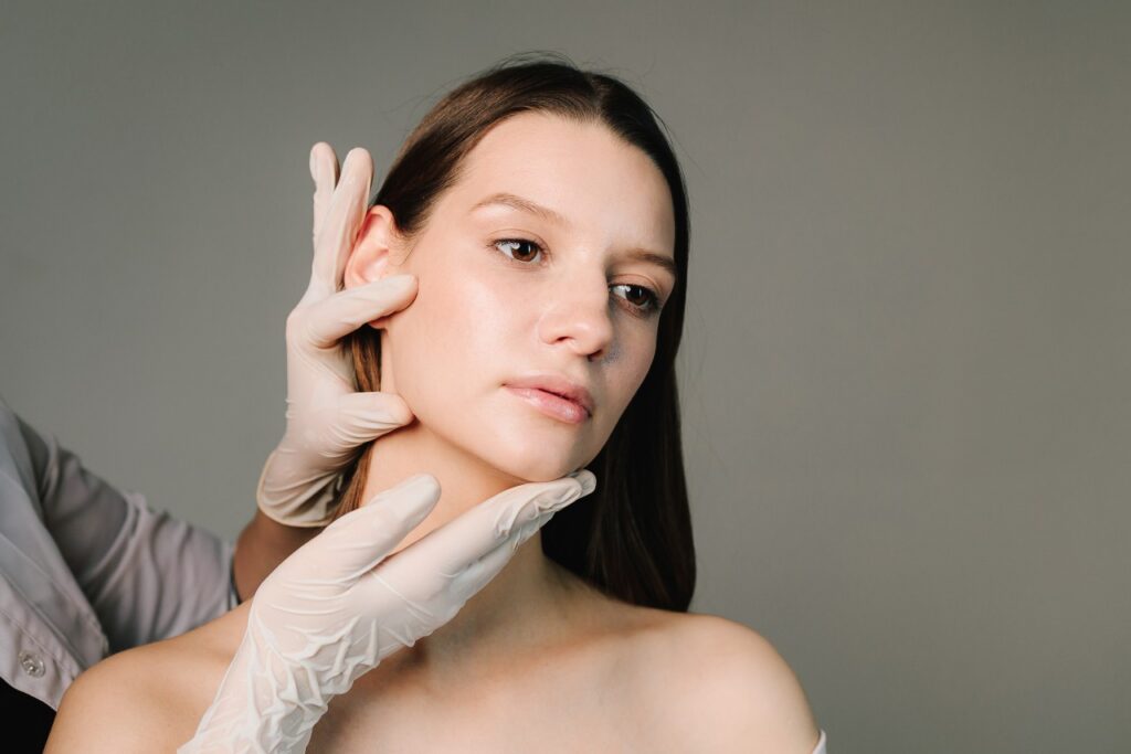 Woman receiving a plastic surgery consultation
