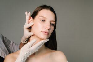Woman receiving a plastic surgery consultation